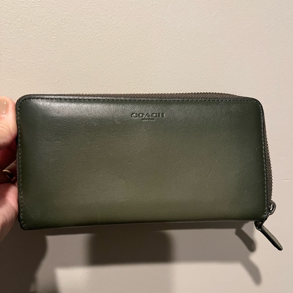 Genuine leather green coach zippered wallet.